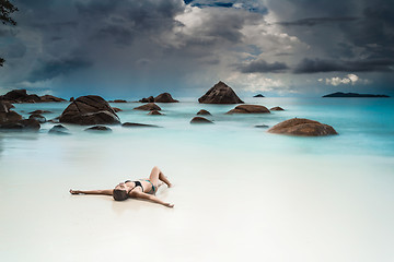 Image showing Woman relaxing at the beach