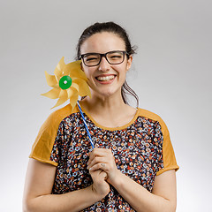 Image showing Playing with a windmill