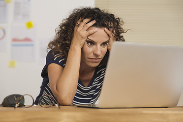 Image showing Exausted woman at the office