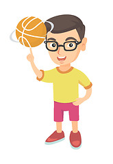 Image showing Caucasian boy spinning basketball ball on finger.