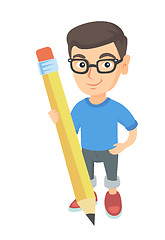 Image showing Caucasian kid boy standing with a huge pencil.