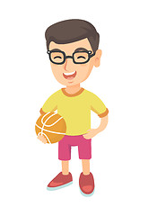 Image showing Laughing schoolboy holding a basketball ball.
