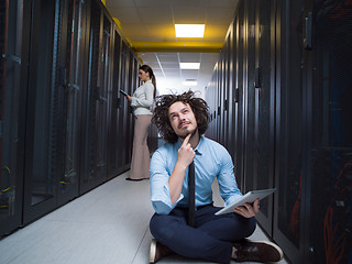 Image showing young technicians working together on servers