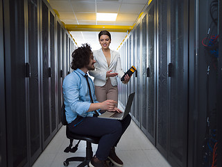 Image showing technicians working together on servers