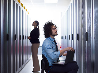 Image showing technicians working together on servers