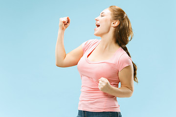 Image showing Winning success woman happy ecstatic celebrating being a winner. Dynamic energetic image of female model