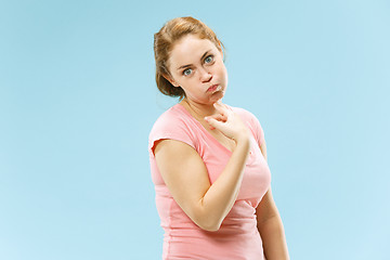 Image showing Beautiful bored woman bored isolated on blue background