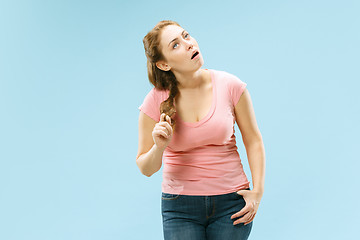 Image showing Beautiful bored woman bored isolated on blue background