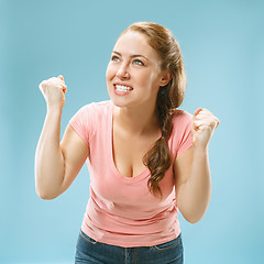 Image showing Winning success woman happy ecstatic celebrating being a winner. Dynamic energetic image of female model