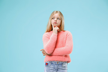 Image showing Young serious thoughtful teen girl. Doubt concept.