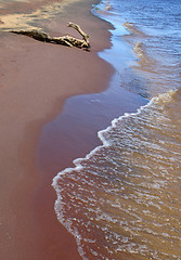 Image showing Waves running over sand coast