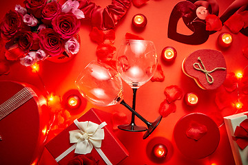 Image showing Valentines day romantic decoration with roses, wine glasses, boxed gifts, candles