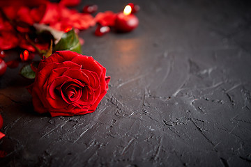 Image showing Red rose, petals, candles, dating accessories, boxed gifts, hearts, sequins