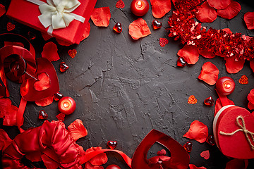 Image showing Red roses petals, candles, dating accessories, boxed gifts, hearts, sequins