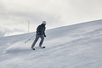 Image showing Skiing in the winter snowy slopes