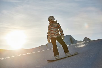 Image showing Snowboarder in sun flare, water drops on lens