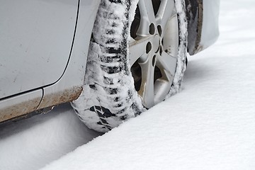 Image showing Car tyre in snow