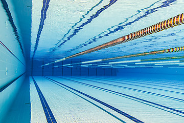 Image showing Olympic Swimming pool under water background.