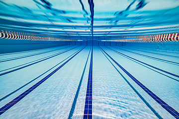 Image showing Olympic Swimming pool under water background.