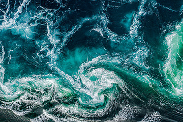 Image showing Abstract background. Waves of water of the river and the sea mee