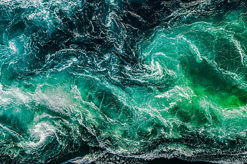 Image showing Abstract background. Waves of water of the river and the sea mee