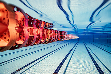 Image showing Olympic Swimming pool under water background.