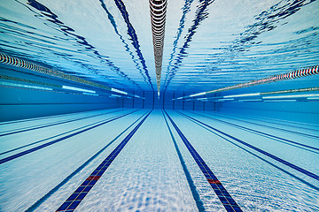 Image showing Olympic Swimming pool under water background.