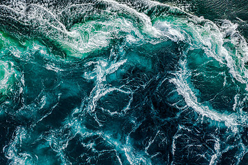 Image showing Abstract background. Waves of water of the river and the sea mee