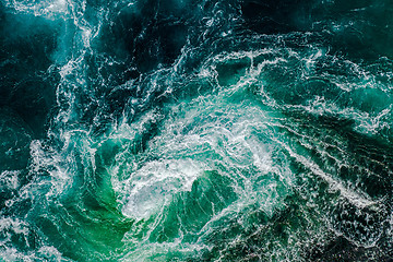 Image showing Abstract background. Waves of water of the river and the sea mee