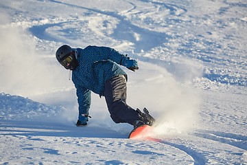 Image showing Snowboarding in fresh powder snow