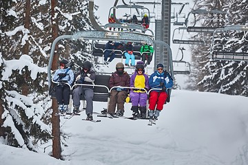 Image showing Skiers on ski lift