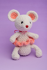 Image showing Knitted with his hands toy mouse on a lilac background