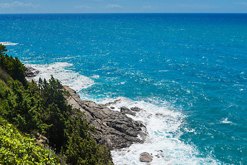 Image showing Beautiful cerulean sea and the rocky beach