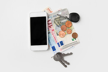 Image showing close up of smartphone, euro money and keys