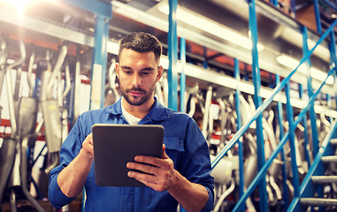 Image showing auto mechanic or smith with tablet pc at workshop