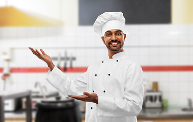 Image showing happy male indian chef at restaurant kitchen