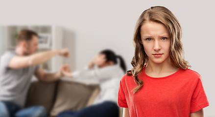 Image showing unhappy girl over her parents having fight