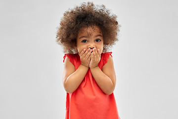 Image showing confused african american girl covering mouth