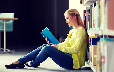 Image showing high school student girl reading book at library