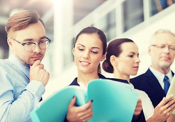 Image showing business team with folders meeting at office