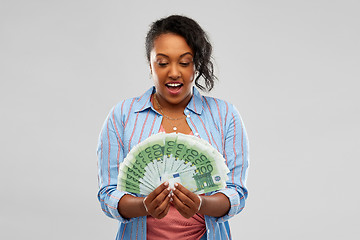 Image showing surprised african american woman with euro money