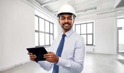 Image showing architect or businessman in helmet with tablet pc