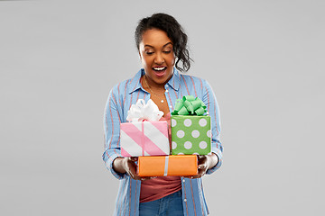 Image showing happy african american woman with birthday gifts