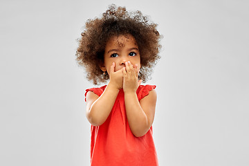 Image showing confused african american girl covering mouth