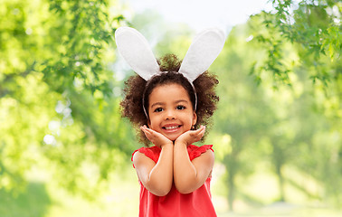 Image showing happy little girl wearing easter bunny ears posing