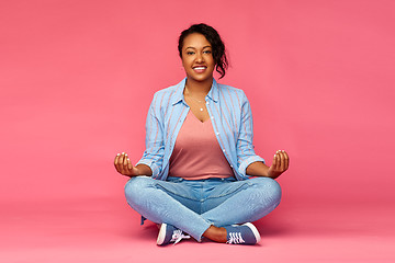 Image showing happy african american woman in yoga lotus pose