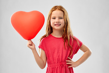 Image showing smiling red haired girl with heart shaped balloon