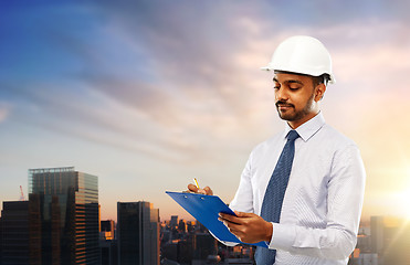 Image showing architect in helmet with clipboard in tokyo