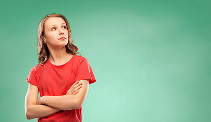 Image showing student girl with crossed arms over green