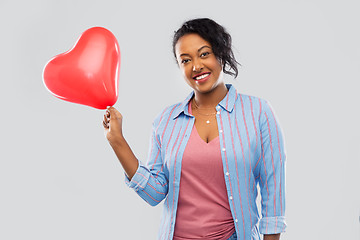 Image showing african american woman with heart-shaped balloon